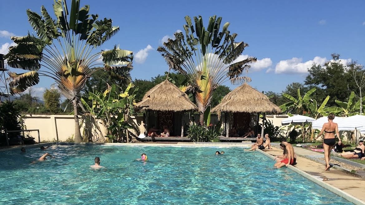 People swimming and relaxing at Fluid Pool in Pai