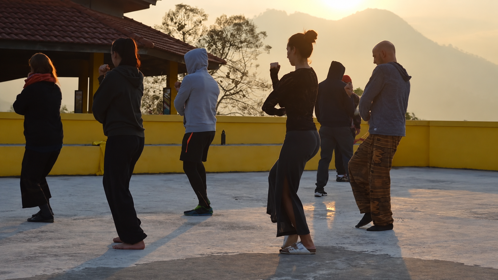 Kung Fu students training at a hilltop retreat in Pai